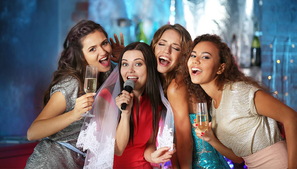Beautiful girls with microphone in nightclub