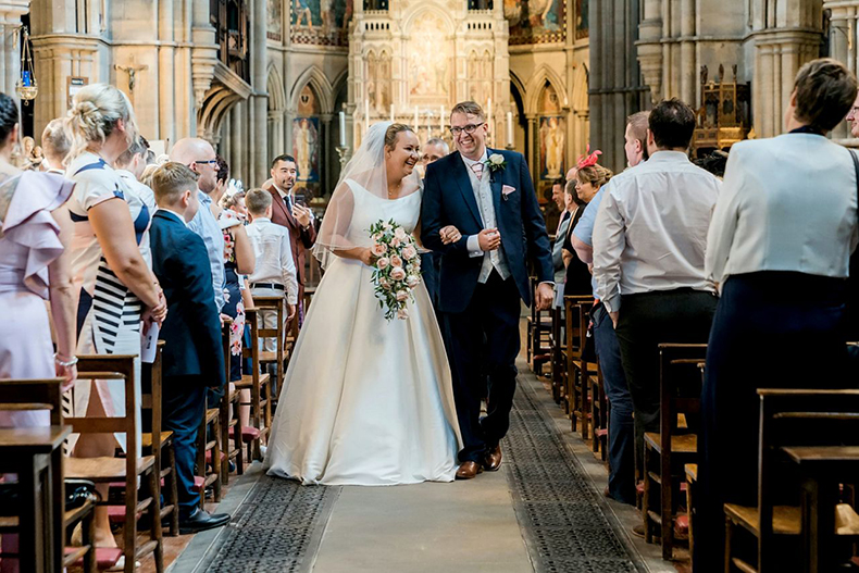 Couple Walking Down The Aisle