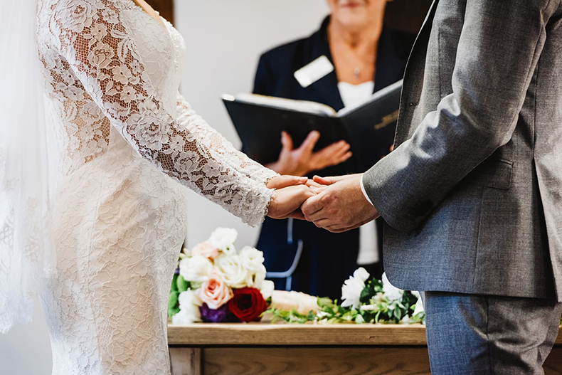 Groom Holding Bride’s Hand