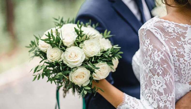 Wedding couple with flowers