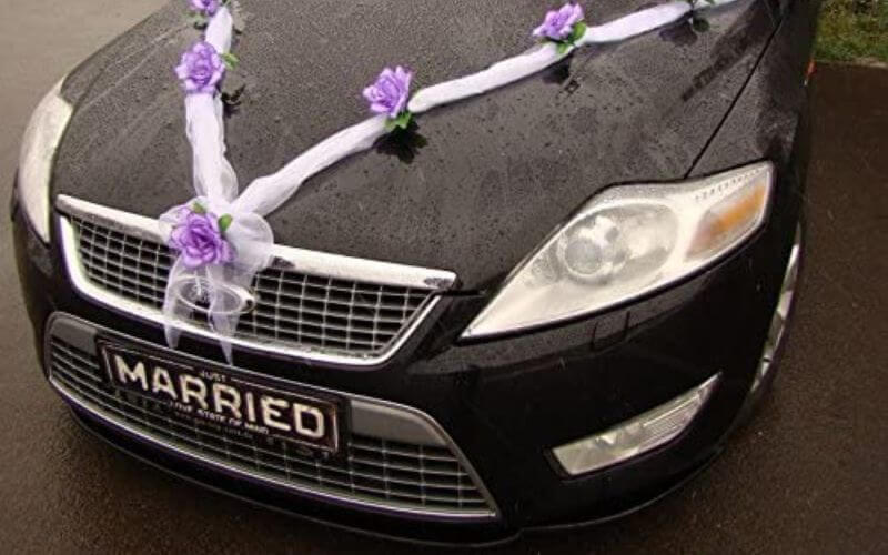 White Ribbon and Purple Themed Floral Corsages Wedding car Decoration Ideas