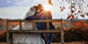 Couple seating on bench after successful marriage