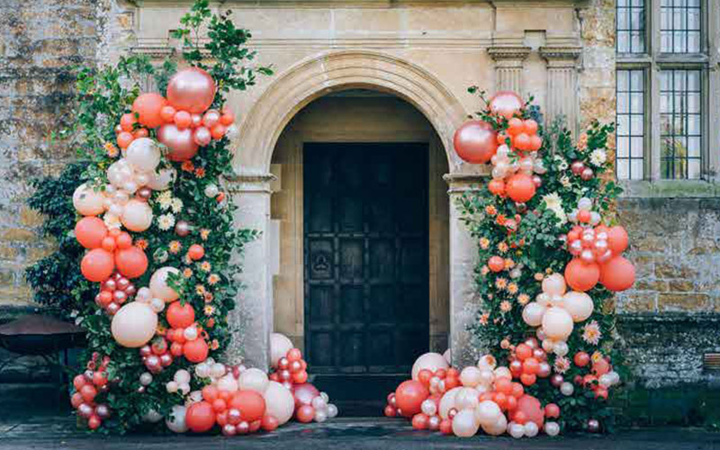 Stunning wedding entrance arch with balloons