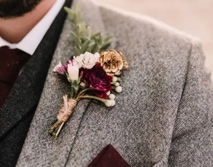 Wintry Roses and Greenery Boutonniere