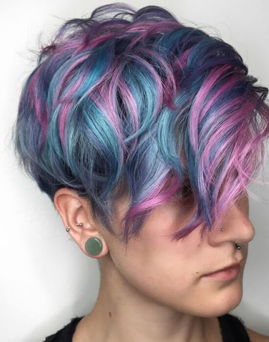 Layered pixie cut with colorful hair extensions.