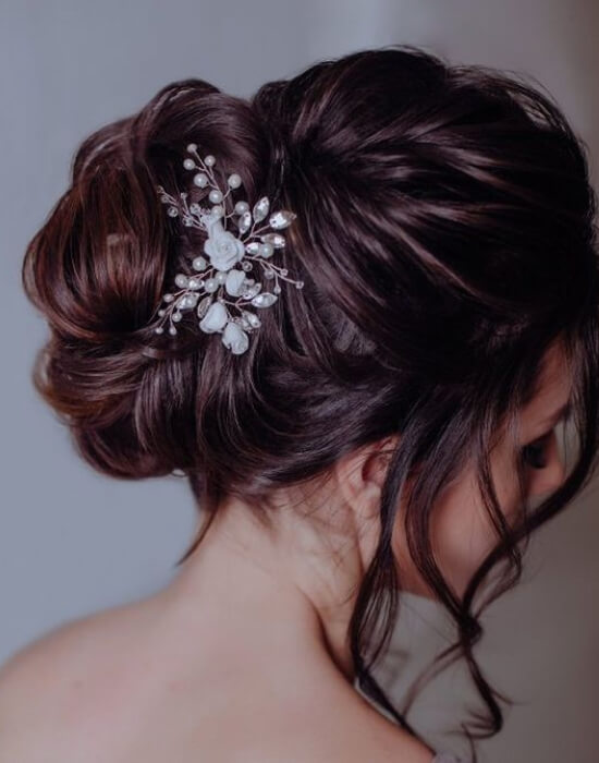 Twisted updo with floral accessories