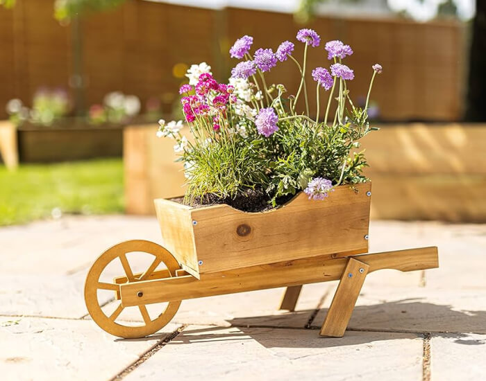 Rustic Wheelbarrow Wishing Well filled with blooms