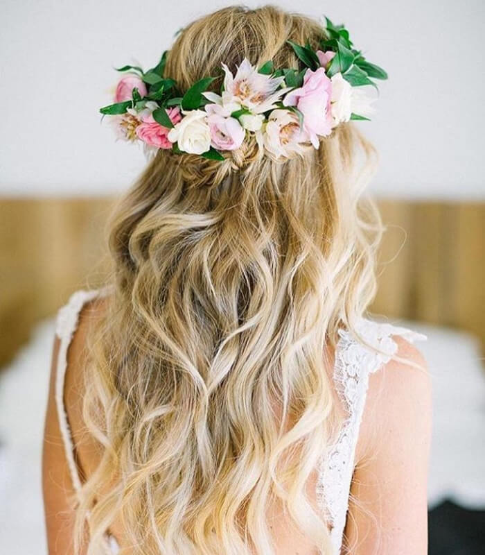 Floral crown paired with a half-up hairstyle