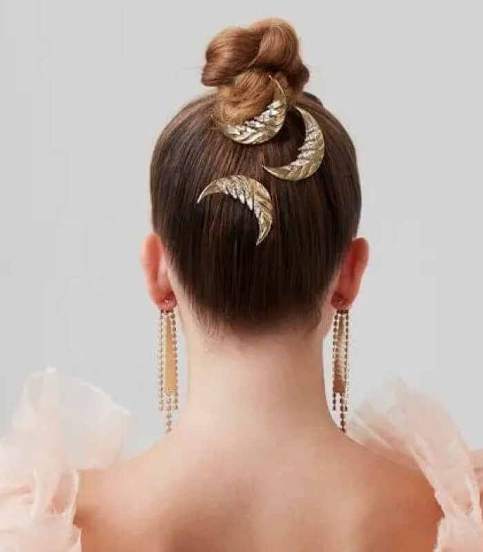 Intricate hair combs or clips as focal points