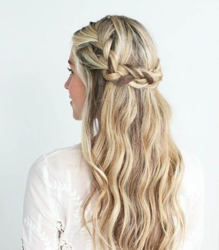 Loose waves with braided crown wedding hairstyle
