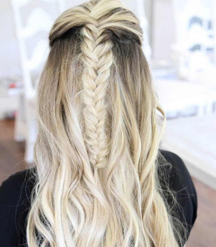 Messy fishtail braid with cascading curls