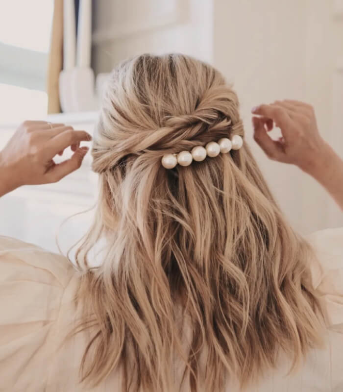 Pearl-studded twisted half updo