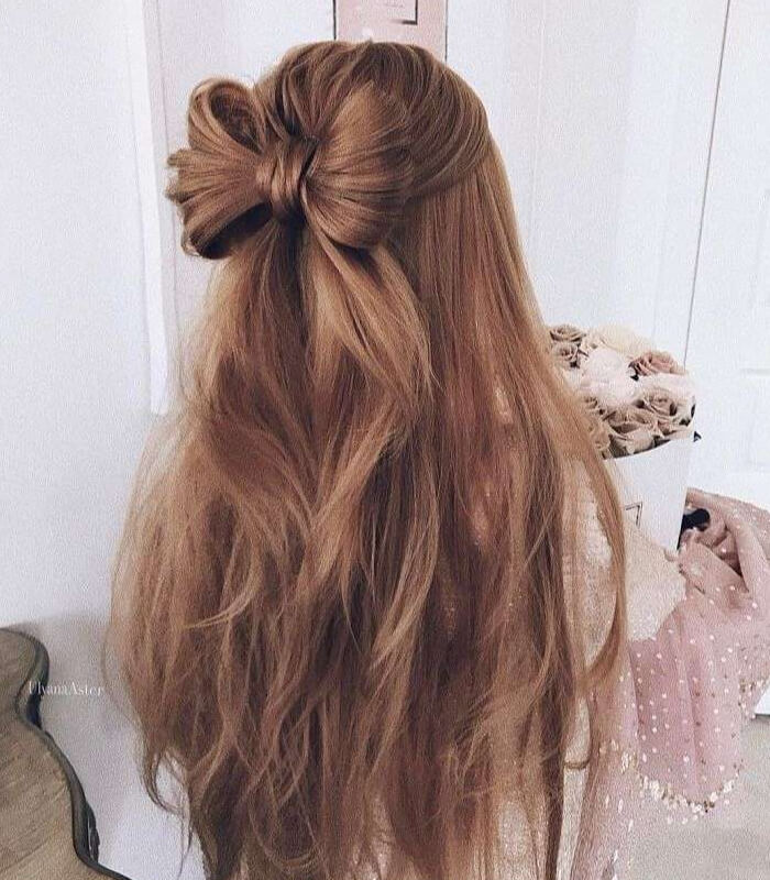 Ribbon-wrapped half up, half down hairstyle
