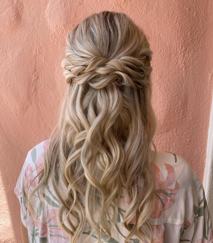 Textured braids incorporated into a half-up hairstyle