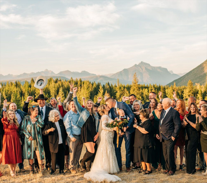 Photo of the Family Surrounding the Couple