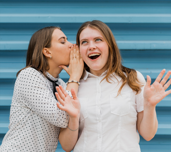 Sibling Whispering Pose