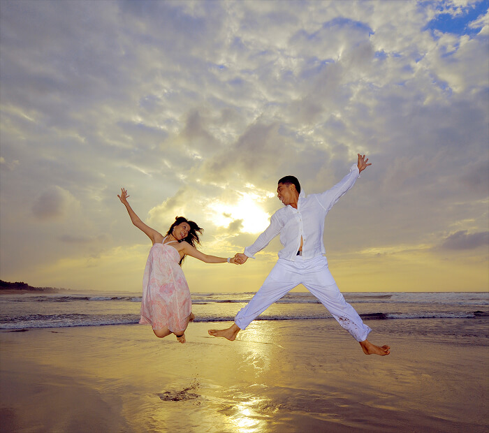 Couple Jumping Together