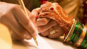 Court Marriage Vs. Traditional Marriage Legal Differences Court marriage ceremony moment with bride’s hands and marriage papers