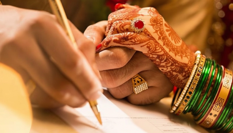 Court marriage ceremony moment with bride’s hands and marriage papers