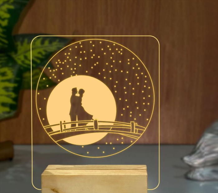 “Romantic couple silhouette LED night lamp with warm glowing design.”