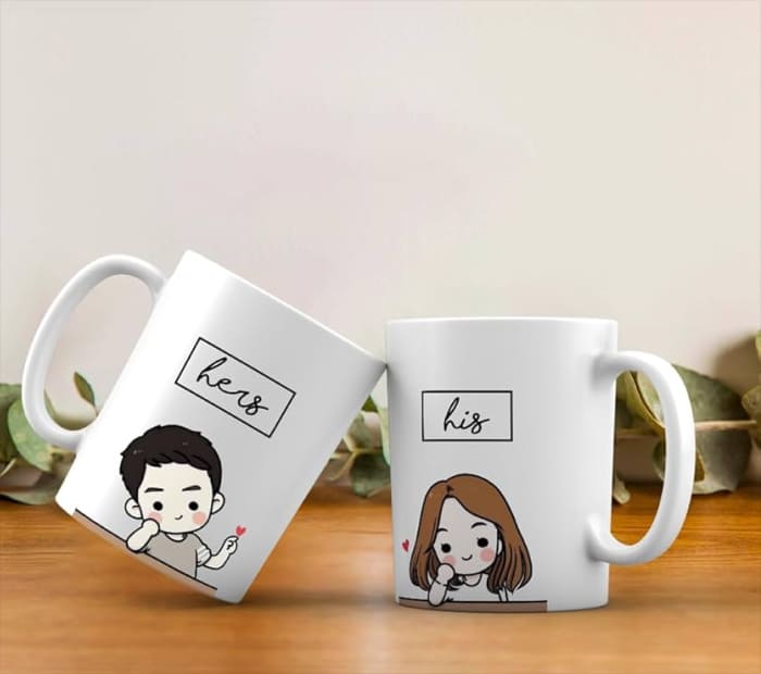 “Matching his and hers couple mugs with cute illustrated characters.”