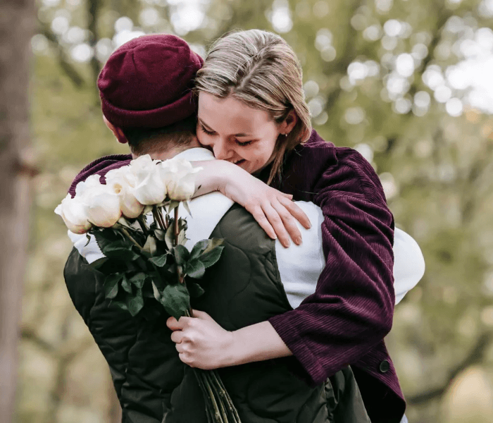 Happy couple hugs. 
